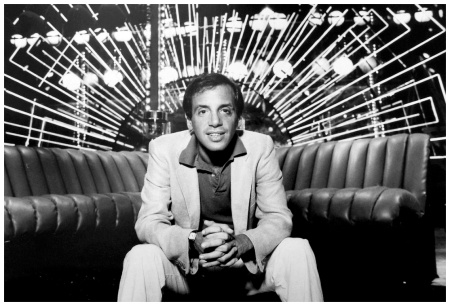 Photo of Steve Rubell on a 1970's %22De Sede Non-Stop%22 sofa with lighting backdrop at Studio 54 (People Weekly)