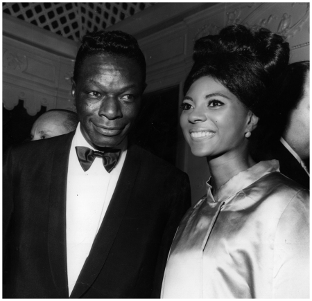 American singer Nat King Cole wishes Leslie Uggams, star of the Mitch Millar TV Show, good luck at her debut at Cocoanut Grove, Hollywood, 1963
