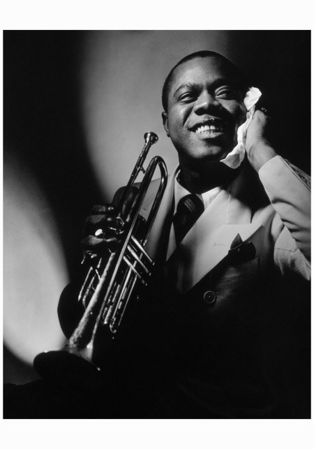 Jazz godfather, luminary, and pioneer Louis Armstrong poses, trumpet in hand, for Anton Bruehl in Vanity Fair (November 1935)