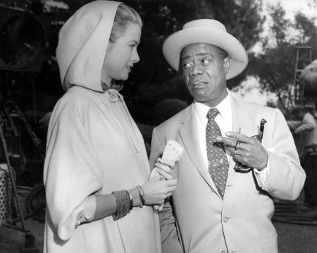 Grace Kelly and Louis Armstrong, 1956 High Society, Jan. 19, 1956 in the Bel Air section of Los Angeles, California. Armstrong and his orchestra perform in the movie which stars Mi